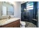 Modern bathroom with granite countertop, chrome faucet, and a large glass-enclosed shower with stone tile at 942 Hanover Way, Lakeland, FL 33813