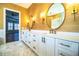 Bathroom with double sinks, custom mirrors, and granite counters at 942 Hanover Way, Lakeland, FL 33813