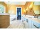 Bathroom with double sinks, custom mirrors, and a soaking tub at 942 Hanover Way, Lakeland, FL 33813