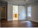 Bedroom with a sliding barn door leading to the bathroom at 942 Hanover Way, Lakeland, FL 33813