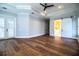 Spacious bedroom with tray ceiling, fan, and bathroom access at 942 Hanover Way, Lakeland, FL 33813