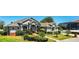 Beautiful single story home featuring mature landscaping, covered entry, and walkway at 942 Hanover Way, Lakeland, FL 33813