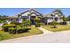 Beautiful single story home featuring mature landscaping, covered entry, and walkway at 942 Hanover Way, Lakeland, FL 33813