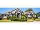 Beautiful single story home featuring mature landscaping, covered entry, and walkway at 942 Hanover Way, Lakeland, FL 33813