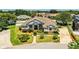 Inviting one-story home featuring lush landscaping, including manicured shrubs, a well-kept lawn, and a welcoming entrance at 942 Hanover Way, Lakeland, FL 33813