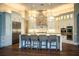 Bright, open kitchen featuring a center island with barstool seating and stainless steel appliances at 942 Hanover Way, Lakeland, FL 33813