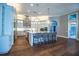 Bright, open kitchen featuring a center island with barstool seating and stainless steel appliances at 942 Hanover Way, Lakeland, FL 33813