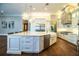 Bright, modern kitchen with stainless steel appliances and a large center island with a sink at 942 Hanover Way, Lakeland, FL 33813