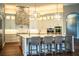 Elegant kitchen featuring a center island with barstool seating and stainless steel appliances at 942 Hanover Way, Lakeland, FL 33813