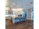 Spacious kitchen with large island, quartz countertops, and modern stainless steel appliances at 942 Hanover Way, Lakeland, FL 33813