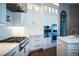 Modern kitchen featuring quartz countertops, stainless steel appliances, and plenty of storage space at 942 Hanover Way, Lakeland, FL 33813