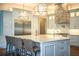 Eat-in kitchen with large island, stainless steel appliances and custom lighting at 942 Hanover Way, Lakeland, FL 33813