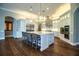 Spacious open kitchen with an island, stainless appliances, and custom cabinets at 942 Hanover Way, Lakeland, FL 33813