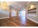 Expansive living room boasts hardwood floors, sliders to pool and built-in shelves at 942 Hanover Way, Lakeland, FL 33813
