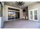 Outdoor living area with sliding glass doors, a ceiling fan, and an outdoor kitchen space at 942 Hanover Way, Lakeland, FL 33813