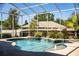 Enclosed pool area with beautiful landscaping and water features that offer a serene escape at 942 Hanover Way, Lakeland, FL 33813