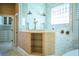 Luxurious shower features dual shower heads, glass enclosure, and convenient shelving for toiletries at 942 Hanover Way, Lakeland, FL 33813