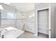 Elegant bathroom featuring a glass shower, granite countertops, and ample cabinet space at 1104 Kells Ct, Lakeland, FL 33813
