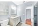 Bathroom featuring marble vanity and ceramic tile floors at 1104 Kells Ct, Lakeland, FL 33813