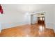 Elegant dining area showcasing hardwood floors, a chandelier, and an open view to the front entrance at 1104 Kells Ct, Lakeland, FL 33813