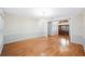 Open-concept foyer with hardwood floors, chandelier, and an inviting entryway at 1104 Kells Ct, Lakeland, FL 33813