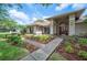 Beautiful single-story home with manicured landscaping and a welcoming front entrance at 1104 Kells Ct, Lakeland, FL 33813