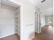 Hallway with a closet and view to the entry door at 1104 Kells Ct, Lakeland, FL 33813