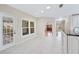 Bright area features kitchen space, an eat-in nook and access to the outdoors at 1104 Kells Ct, Lakeland, FL 33813