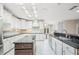Well-lit kitchen boasts ample counter space, an island, and modern appliances at 1104 Kells Ct, Lakeland, FL 33813