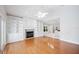 Bright living space with hardwood floors, built-in shelving, and a modern ceiling fan at 1104 Kells Ct, Lakeland, FL 33813
