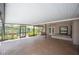 Large screened patio with brick floors, ceiling fan, and an outdoor space at 1104 Kells Ct, Lakeland, FL 33813