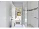 Stand up shower with pebble floor and access to the backyard at 1104 Kells Ct, Lakeland, FL 33813