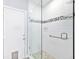 Beautiful stand up shower with subway tile and pebble floor detail at 1104 Kells Ct, Lakeland, FL 33813