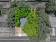 Aerial shot of the home, surrounded by mature trees, providing a sense of privacy at 1720 Kendrick Ln, Lakeland, FL 33805