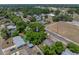 An aerial view captures the lush greenery and landscaping surrounding this lovely home at 1720 Kendrick Ln, Lakeland, FL 33805