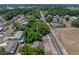 Aerial shot displays mature trees surrounding the home in a quaint residential area at 1720 Kendrick Ln, Lakeland, FL 33805