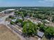 This is an aerial view of a cozy home nestled among mature trees in a residential area at 1720 Kendrick Ln, Lakeland, FL 33805