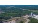 Broad aerial view shows highways, industrial buildings and facilities bordered by a dense tree line at 1720 Kendrick Ln, Lakeland, FL 33805