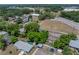 The aerial view shows a beautiful home surrounded by mature trees and landscaping at 1720 Kendrick Ln, Lakeland, FL 33805