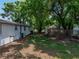 Backyard view showing property line and partial side view of home at 1720 Kendrick Ln, Lakeland, FL 33805
