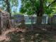 Backyard view showing chain link fence and sheds at 1720 Kendrick Ln, Lakeland, FL 33805