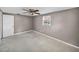 Cozy bedroom with neutral walls and ceiling fan at 1720 Kendrick Ln, Lakeland, FL 33805