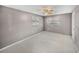 Comfortable bedroom featuring a ceiling fan and natural light from the windows at 1720 Kendrick Ln, Lakeland, FL 33805