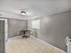 Compact dining area with neutral gray walls, tile flooring, and standard lighting at 1720 Kendrick Ln, Lakeland, FL 33805