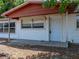 Exterior view of the home with vinyl siding, showing the address on the front of the house at 1720 Kendrick Ln, Lakeland, FL 33805
