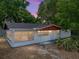 Charming single-story home with a cozy covered porch, mature trees, and a well-maintained front yard at 1720 Kendrick Ln, Lakeland, FL 33805