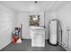 Functional laundry area with washer hookups and water heater at 1720 Kendrick Ln, Lakeland, FL 33805