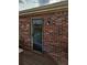 Exterior view of a back door with brick surround at 1920 E Edgewood Dr # T6, Lakeland, FL 33803