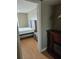 Bedroom view featuring wood-look flooring and neutral colored walls at 1920 E Edgewood Dr # T6, Lakeland, FL 33803