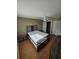 Spacious bedroom featuring sleek furniture and a ceiling fan at 1920 E Edgewood Dr # T6, Lakeland, FL 33803